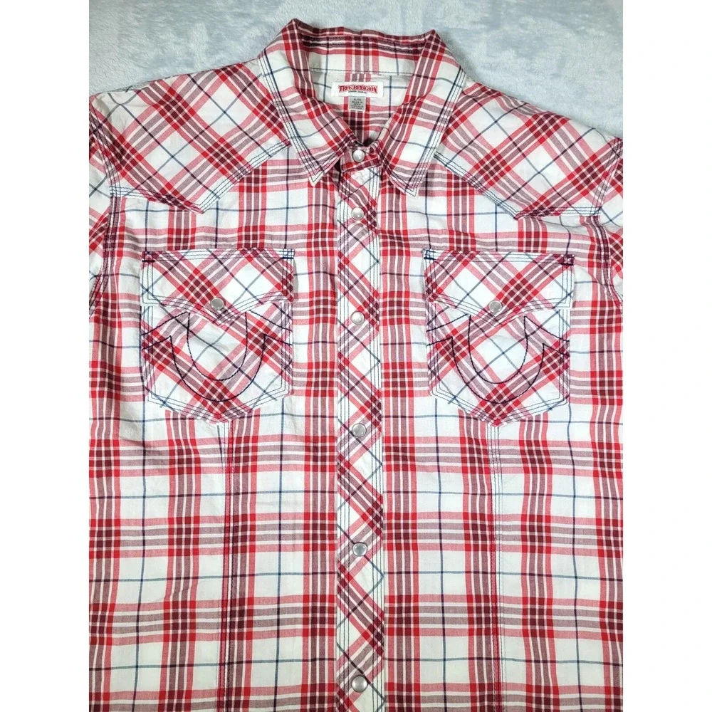 True Religion tears owned